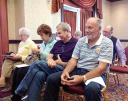 23 Members Listening to Old Business