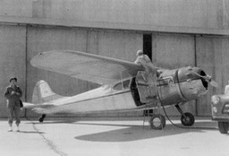 1955 Oct - Mary Carmel waching as Tom's plane serviced at Little Rock, AR