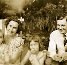 Nan about age 7 (in center) with parents and sister 